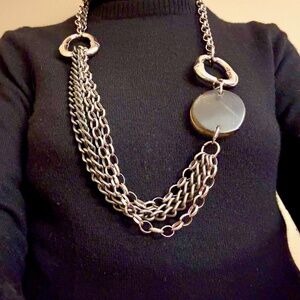 Statement-making chain necklace in silver and black with rock accent